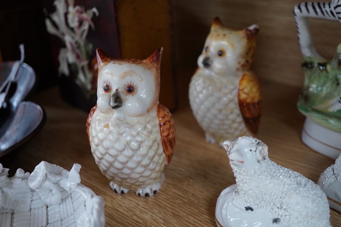 A pair of Worcester 'owl' candle snuffers, Staffordshire Zebra and two sheep, Belleek etc zebra 19cm wide.